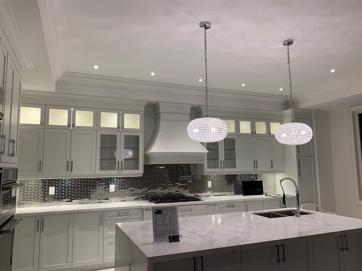 Crystal pendant lights over kitchen island